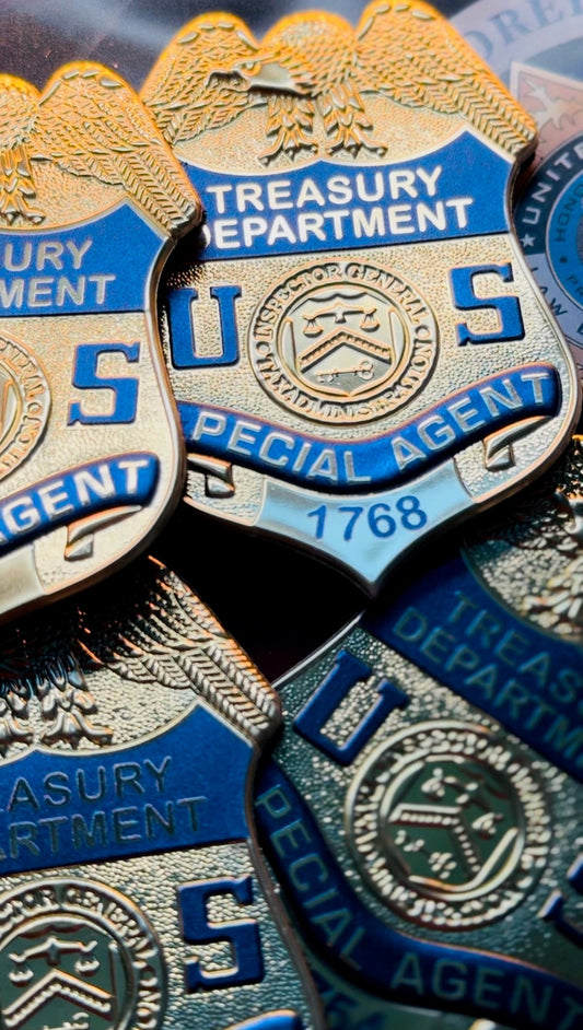 Close-up of U.S. Treasury Department Special Agent flex badges.