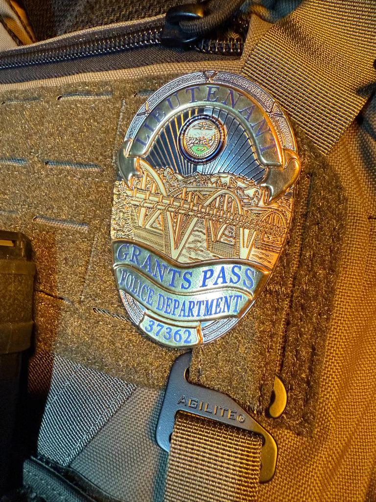 Grants Pass Police Department flex badge on a tactical pouch