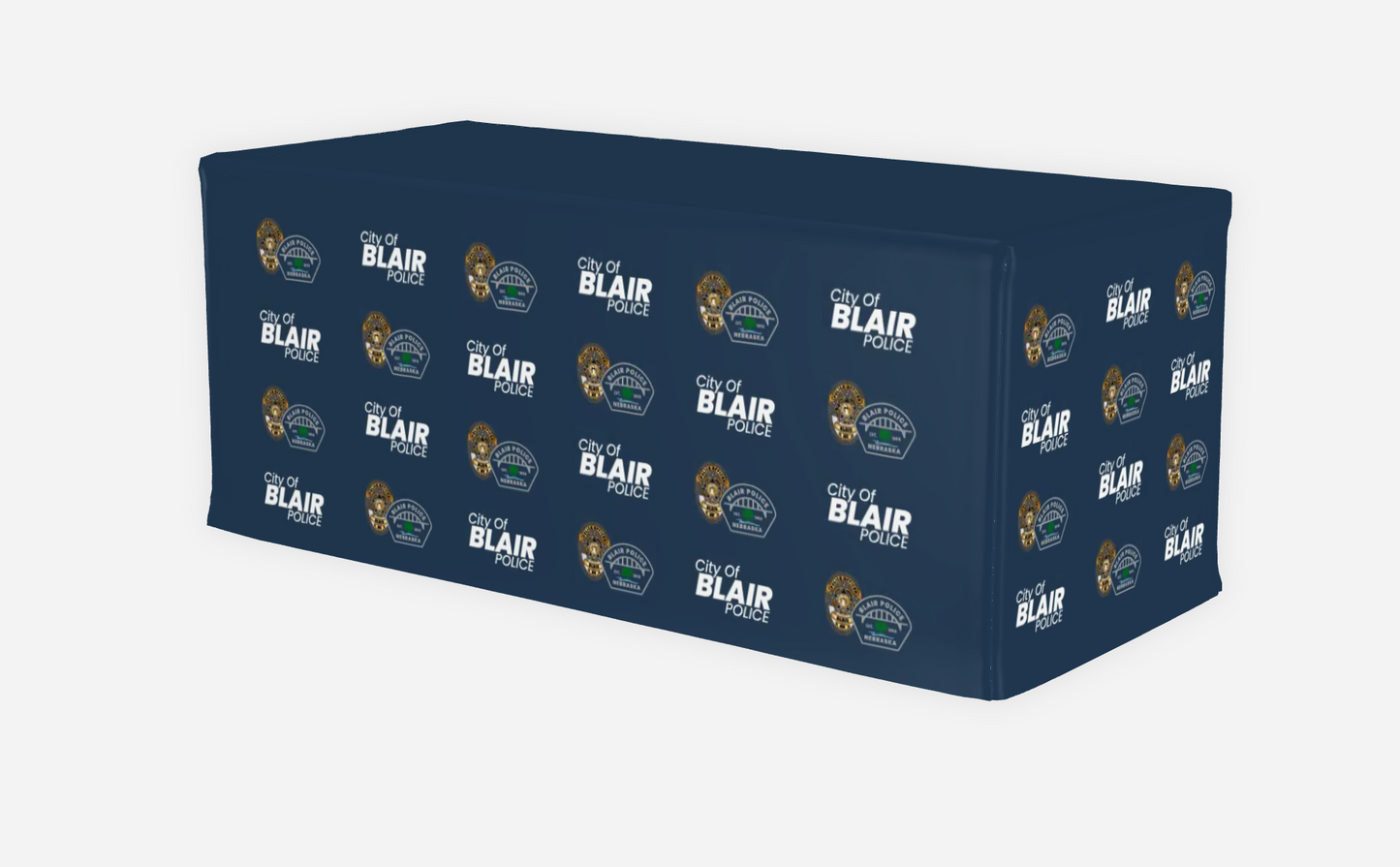 Navy blue table cover with 'City of Blair' logo pattern on a white background