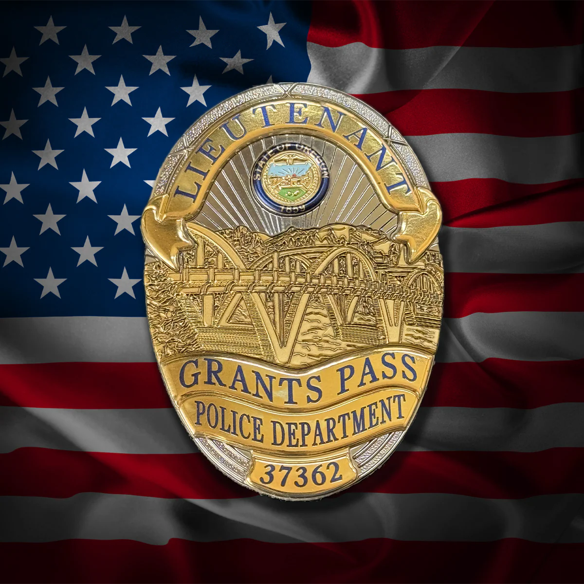 Grants Pass Police Department flex badge on an American flag background
