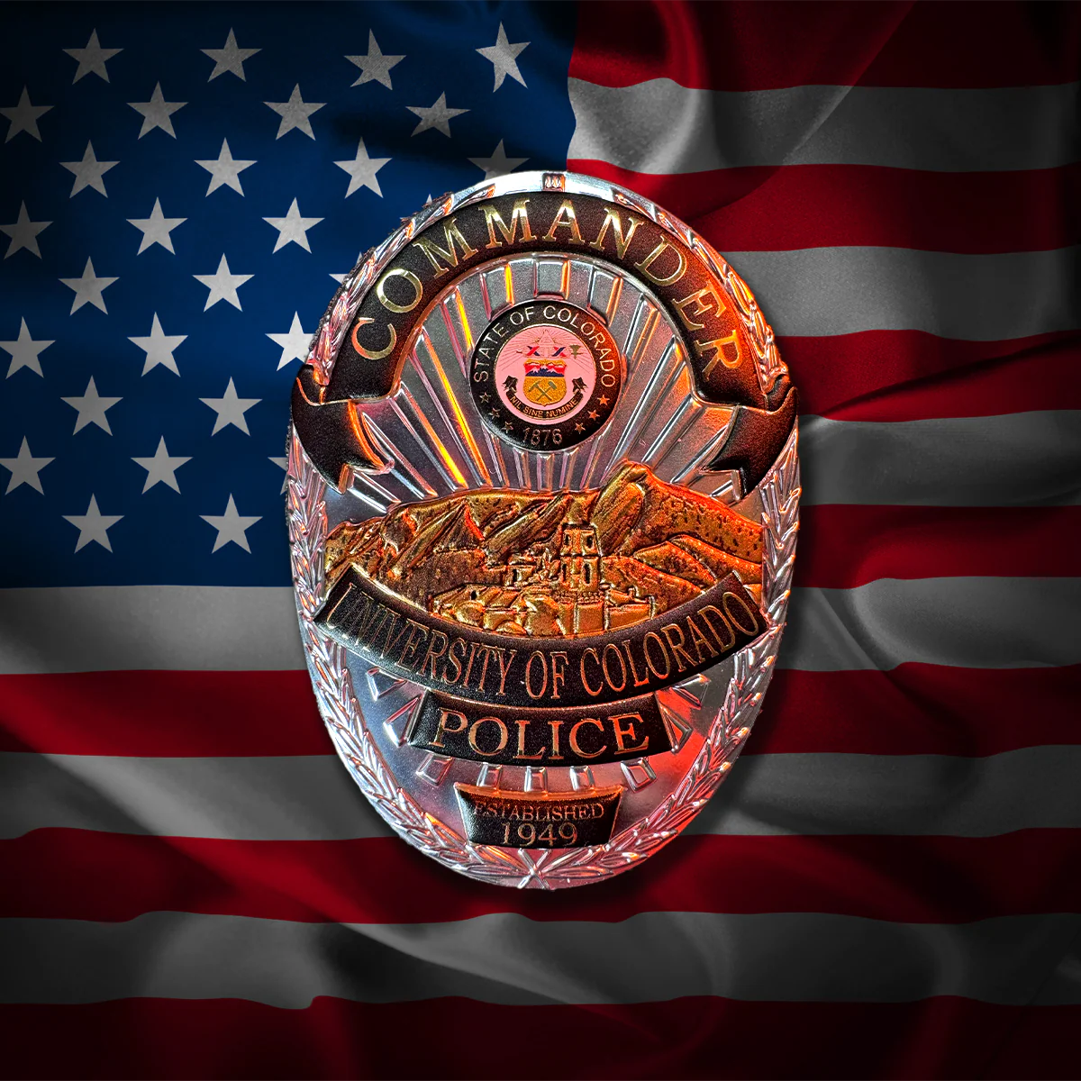 University of Colorado Police flex badge on an American flag background