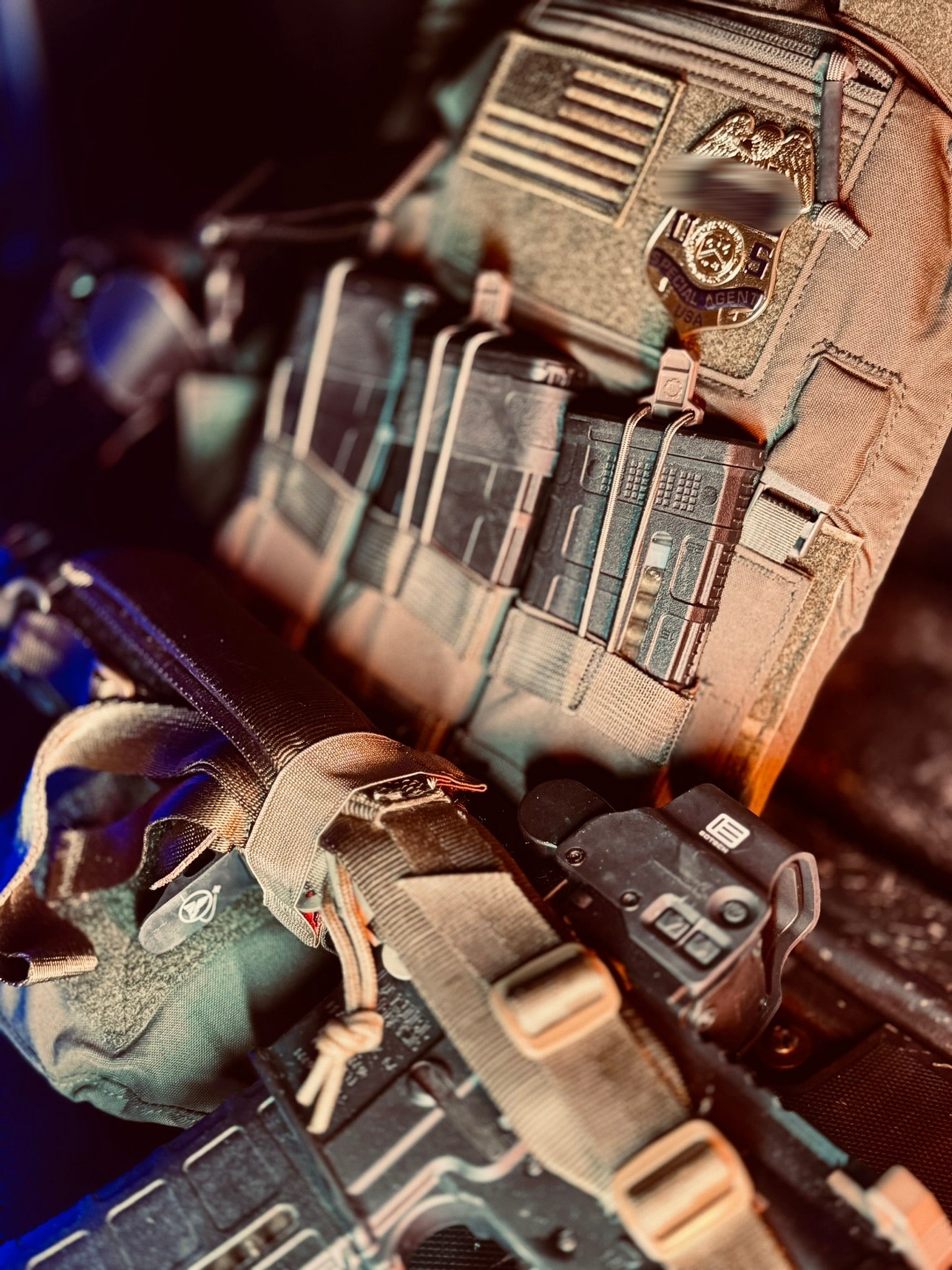 Close-up of tactical gear with a focus on a helmet and backpack with a flex badge