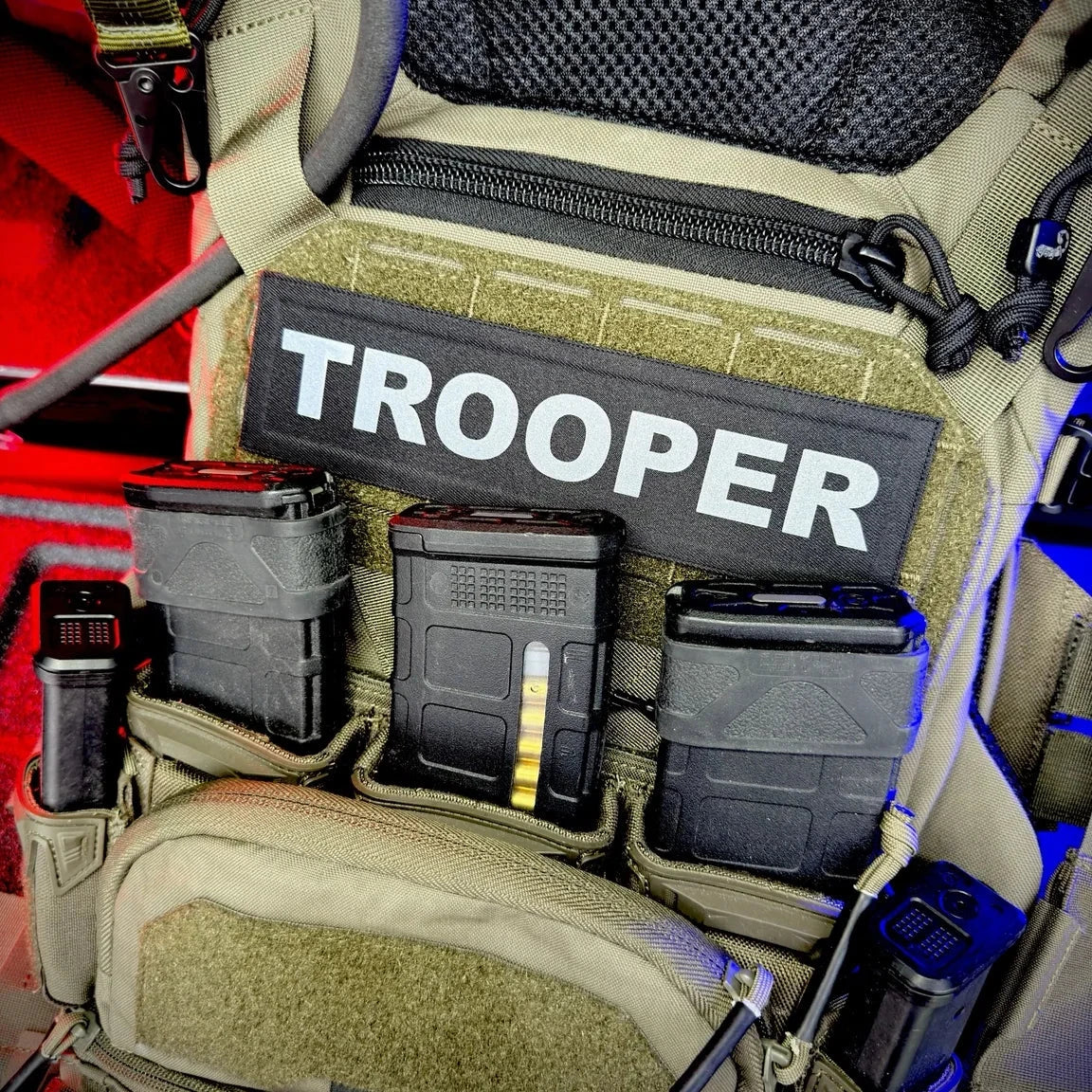  tactical vest with 'TROOPER' patch and various compartments