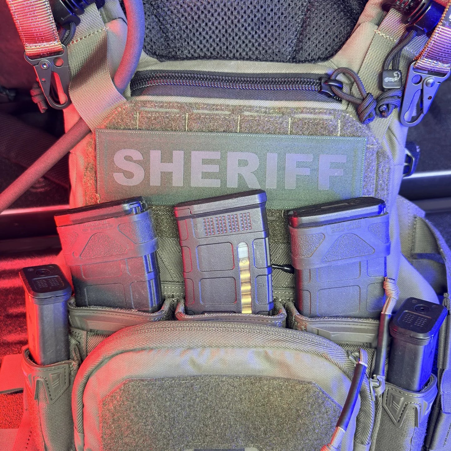 Tactical vest with ammunition pouches and 'SHERIFF' branding.