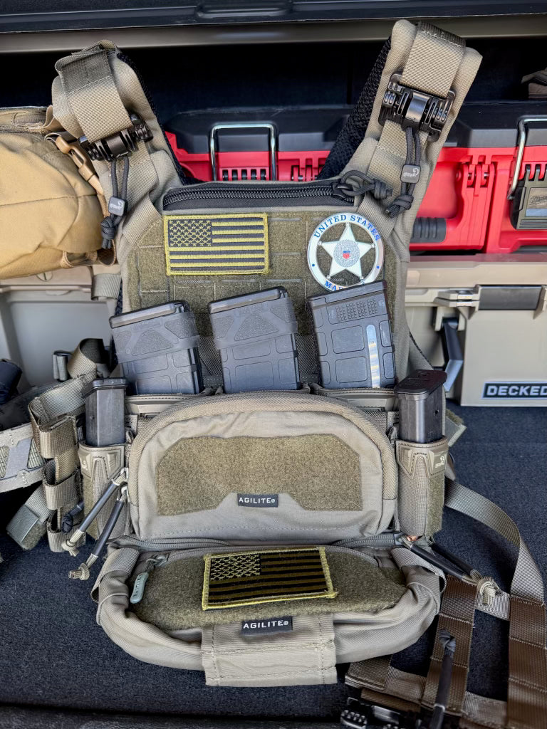 Tactical vest with American flag and Marshal Flex Badge Patch on a vehicle interior.