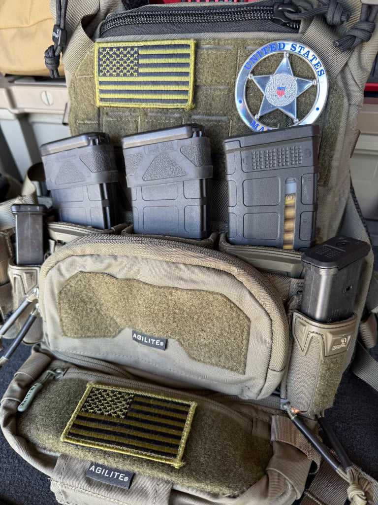  tactical gear with American flag patches and 'United States marshals' flex badge