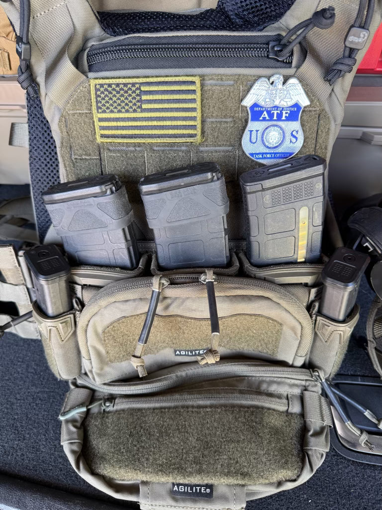  tactical vest with multiple pouches and an ATF TFO flex badge patch