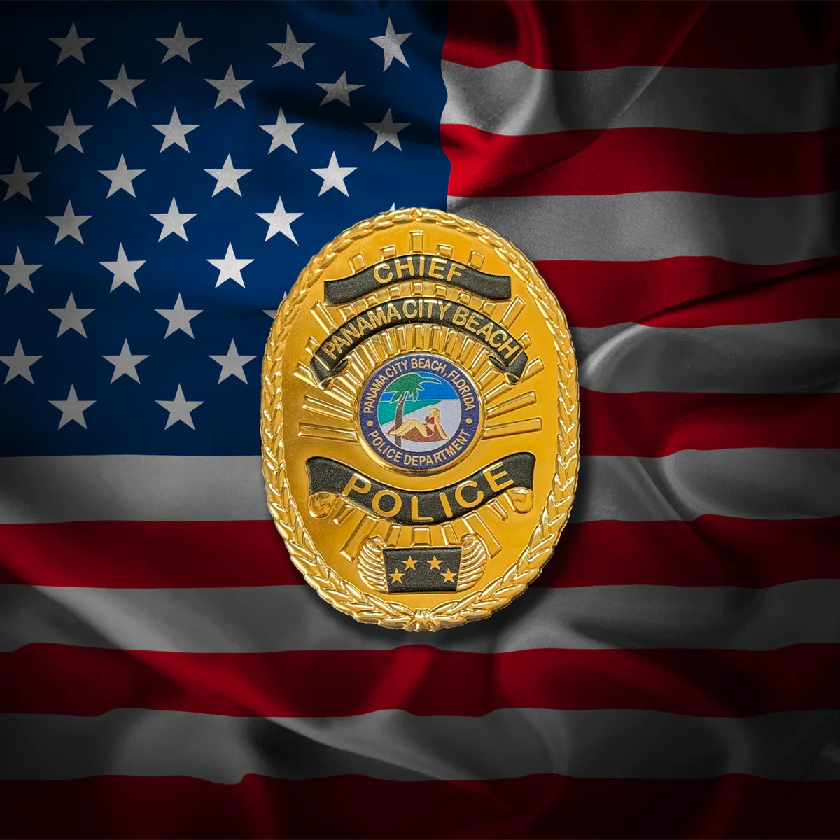 Gold police flex badge on an American flag background