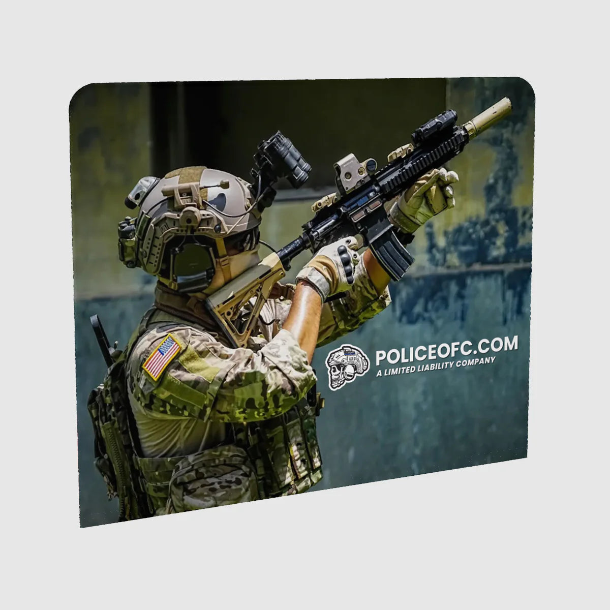 Person in tactical gear holding a rifle with a blurred background