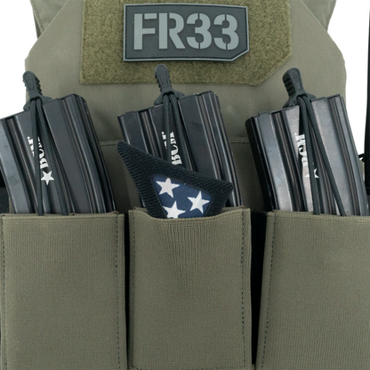 Green tactical vest with multiple magazine pouches and 'FR33' patch.