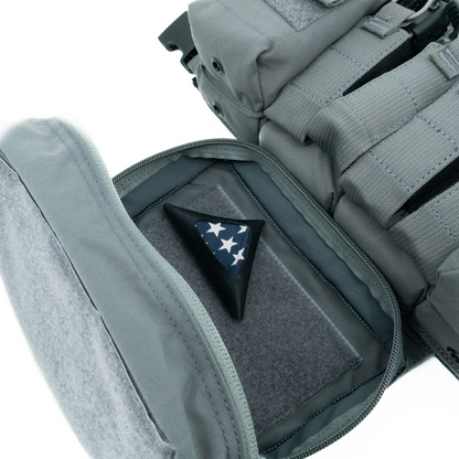 Gray tactical vest with a patch featuring a star design on a white background