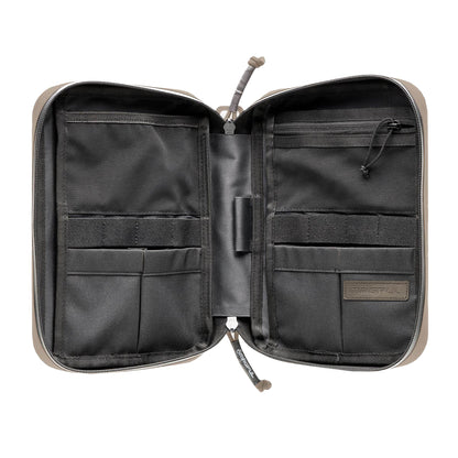 Open tactical pouch with multiple compartments on a white background