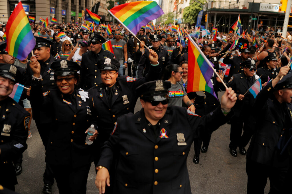 Cops marching in a pride parade. 